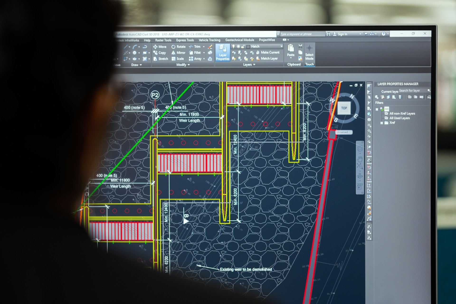 Close-up of engineering blueprints and tools